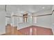 Open-concept living room featuring tile flooring, pillars and recessed lighting at 5370 Boxtree Ct, Dade City, FL 33523