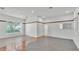 Bright living room with tile flooring, neutral walls, and large windows offering natural light at 5370 Boxtree Ct, Dade City, FL 33523