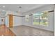 Bright living room with large windows offering neighborhood views at 5370 Boxtree Ct, Dade City, FL 33523