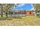 Spacious screened-in patio offering a relaxing outdoor living space with ample natural light and views of the backyard at 5370 Boxtree Ct, Dade City, FL 33523
