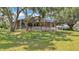 Large screened-in patio providing a serene outdoor retreat with plenty of space for relaxation and entertainment at 5370 Boxtree Ct, Dade City, FL 33523
