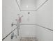 Bathroom shower with marble accents, a shower head, and a handheld sprayer at 5903 Cachette De Riviera Ct, New Port Richey, FL 34655