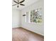 Bedroom with vinyl floors, large window, and ceiling fan; perfect for relaxation at 5903 Cachette De Riviera Ct, New Port Richey, FL 34655