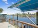 Detailed view of the boat lift and dock, offering a glimpse of waterfront living and recreational opportunities at 5903 Cachette De Riviera Ct, New Port Richey, FL 34655