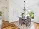 Elegant dining room features hardwood floors and chandelier at 5903 Cachette De Riviera Ct, New Port Richey, FL 34655