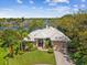 Stunning waterfront home with lush landscaping and a tile roof and beautiful water views at 5903 Cachette De Riviera Ct, New Port Richey, FL 34655