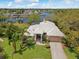 Stunning waterfront home with lush landscaping and a tile roof and beautiful water views at 5903 Cachette De Riviera Ct, New Port Richey, FL 34655