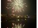Spectacular fireworks display over the waterfront, creating a vibrant and celebratory atmosphere at 5903 Cachette De Riviera Ct, New Port Richey, FL 34655