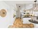 Bright kitchen featuring a center island, white cabinets, tile floors, and stainless steel appliances at 5903 Cachette De Riviera Ct, New Port Richey, FL 34655