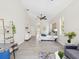 Bright bedroom with high ceilings, ensuite bathroom and living area with views of the backyard at 5903 Cachette De Riviera Ct, New Port Richey, FL 34655