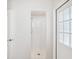 Bright white tiled shower stall with glass door, ready for a refreshing experience at 5903 Cachette De Riviera Ct, New Port Richey, FL 34655