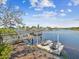 Waterfront view with boat dock, jet skis, and a scenic overlook showcasing the beautiful river at 5903 Cachette De Riviera Ct, New Port Richey, FL 34655