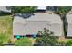 Overhead view of building with well-maintained roof and lush surrounding greenery at 6012 28Th W St, Bradenton, FL 34207
