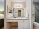 Open bathroom featuring granite countertop vanity, and adjacent access to shower and closet at 6012 28Th W St, Bradenton, FL 34207