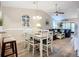 Inviting dining area with modern table and chairs, seamlessly connected to the living room at 6012 28Th W St, Bradenton, FL 34207