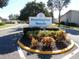 Community entrance sign, 'Huntington Woods,' surrounded by well-maintained landscaping at 6012 28Th W St, Bradenton, FL 34207