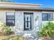 Charming front entrance with decorative lizard and updated windows, providing a welcoming curb appeal at 6012 28Th W St, Bradenton, FL 34207