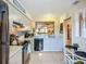 Open kitchen layout offering bar seating and easy access to the living area, ideal for entertaining at 6012 28Th W St, Bradenton, FL 34207