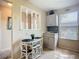 Bright kitchen nook with cozy breakfast table and chairs, adjacent to storage at 6012 28Th W St, Bradenton, FL 34207