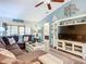 Comfortable living room with sectional sofa, ceiling fan and entertainment center, bathed in natural light at 6012 28Th W St, Bradenton, FL 34207