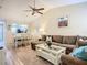 Open-concept living space featuring a comfortable sectional sofa, adjacent to dining area and bright kitchen at 6012 28Th W St, Bradenton, FL 34207