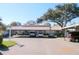 Exterior view of the parking area showing carports and building facade at 6012 28Th W St, Bradenton, FL 34207