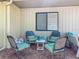 Relaxing patio with four cushioned chairs arranged around a small table at 6012 28Th W St, Bradenton, FL 34207