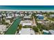 Breathtaking aerial view of waterfront homes along a canal, showcasing coastal living at its finest at 9712 Little Gasparilla Is, Boca Grande, FL 33921
