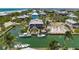 Aerial view of the home and waterfront, showcasing boat dock, boat lift, and gulf access at 9712 Little Gasparilla Is, Boca Grande, FL 33921