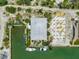 Birds eye view of the waterfront home featuring a dock, boat, and canal front access at 9712 Little Gasparilla Is, Boca Grande, FL 33921