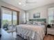 Bedroom with a view to the outdoor patio via sliding glass doors at 9712 Little Gasparilla Is, Boca Grande, FL 33921
