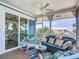 Relaxing screened porch with colorful decor and scenic views of the surrounding landscape at 9712 Little Gasparilla Is, Boca Grande, FL 33921