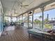 Spacious screened deck with seating and canal views at 9712 Little Gasparilla Is, Boca Grande, FL 33921