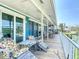 Spacious covered deck with comfortable seating overlooking the serene canal at 9712 Little Gasparilla Is, Boca Grande, FL 33921