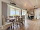 Dining room with wood table and chairs and views of the outside through sliding doors at 9712 Little Gasparilla Is, Boca Grande, FL 33921