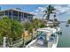 Waterfront home with dock, boat lift, screened porch and lush tropical landscaping at 9712 Little Gasparilla Is, Boca Grande, FL 33921