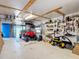 Spacious garage with ample storage, pegboard walls, and room for a golf cart at 9712 Little Gasparilla Is, Boca Grande, FL 33921