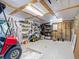 Well-organized garage interior with storage solutions and a golf cart at 9712 Little Gasparilla Is, Boca Grande, FL 33921