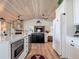 Modern kitchen with white cabinets, marble countertops, and stainless steel appliances at 9712 Little Gasparilla Is, Boca Grande, FL 33921