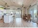 Kitchen with bar seating adjacent to the dining area with plenty of natural light at 9712 Little Gasparilla Is, Boca Grande, FL 33921
