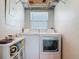 Well-equipped laundry room with modern washer and dryer units at 9712 Little Gasparilla Is, Boca Grande, FL 33921