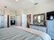 Large main bedroom featuring a dresser and a view into the bathroom at 9712 Little Gasparilla Is, Boca Grande, FL 33921