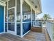 Inviting screened porch perfect for outdoor dining and enjoying tropical views at 9712 Little Gasparilla Is, Boca Grande, FL 33921