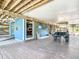Under-home area featuring golf cart parking and beachy decor at 9712 Little Gasparilla Is, Boca Grande, FL 33921