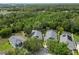 Expansive aerial view of several homes, highlighting lush landscaping and neighborhood layout at 16804 Hawkridge Rd, Lithia, FL 33547