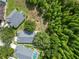 Birds-eye view of landscaped properties bordering a dense forest, close to a tree farm at 16804 Hawkridge Rd, Lithia, FL 33547
