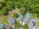 Overhead shot showing backyard pools and dense tree coverage, offering privacy at 16804 Hawkridge Rd, Lithia, FL 33547