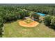 Aerial view of a community baseball field surrounded by green grass and lush landscaping at 16804 Hawkridge Rd, Lithia, FL 33547