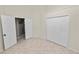 Neutral bedroom with closet and entry doors at 16804 Hawkridge Rd, Lithia, FL 33547