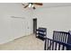 Bright bedroom featuring a ceiling fan, closet, and blue Bedroom furniture set at 16804 Hawkridge Rd, Lithia, FL 33547